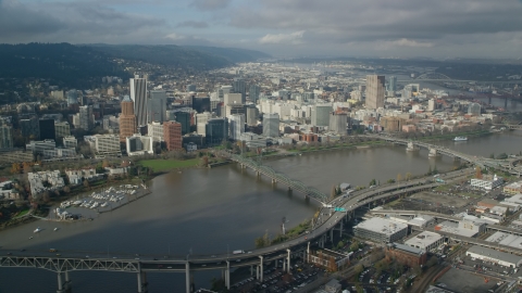 AX153_083.0000000F - Aerial stock photo of Hawthorne Bridge and skyscrapers in Downtown Portland, Oregon