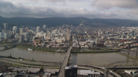 AX153_104.0000287F - Aerial stock photo of The Burnside Bridge leading to Downtown Portland, Oregon