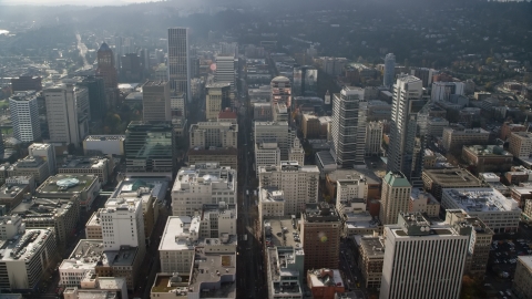 AX153_106.0000260F - Aerial stock photo of SW 6th Avenue and tall skyscrapers in Downtown Portland, Oregon