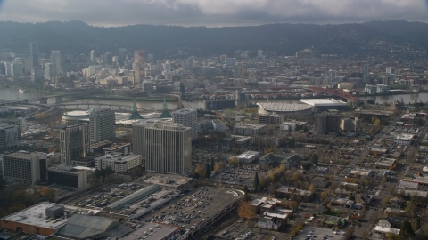 Downtown Portland behind office buildings and Moda Center, Oregon  Aerial Stock Photos | AX153_111.0000319F