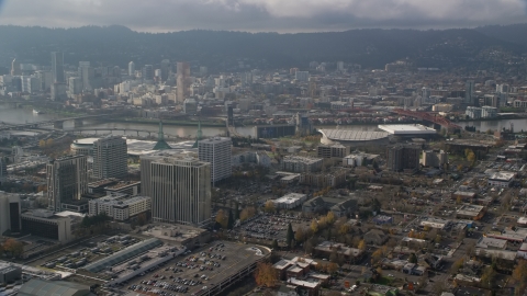 Downtown Portland skyscrapers across the river from office buildings and Moda Center in Oregon Aerial Stock Photos | AX153_112.0000000F