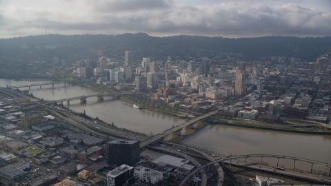 AX153_122.0000000F - Aerial stock photo of Bridges over the Willamette River and skyscrapers in Downtown Portland, Oregon