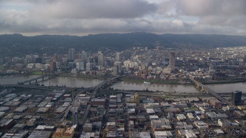 AX153_127.0000347F - Aerial stock photo of Hawthorne, Morrison, and Burnside Bridges, and skyscrapers in Downtown Portland, Oregon