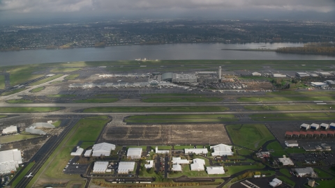 AX153_133.0000232F - Aerial stock photo of Portland International Airport and the Columbia River in Oregon