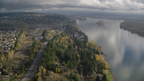 AX153_144.0000281F - Aerial stock photo of Riverfront homes between Highway 14 and the Columbia River in Vancouver, Washington