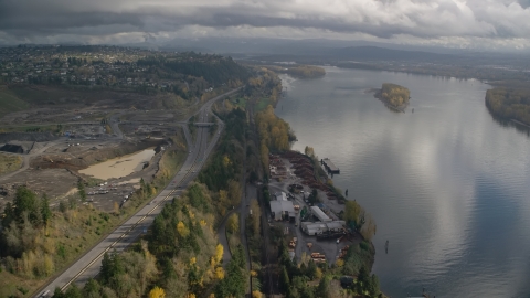 AX153_145.0000185F - Aerial stock photo of A lumber mill on the Columbia River near Highway 14, Camas and Vancouver, Washington