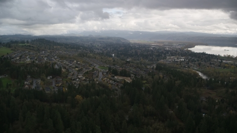 AX153_158.0000000F - Aerial stock photo of Tract homes in the small town of Camas, Washington