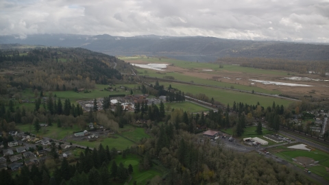 Train traveling through countryside, Washougal, Washington Aerial Stock Photos | AX153_176.0000111F