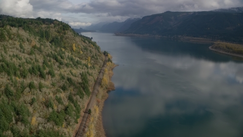 Train tracks at the bottom of a cliff in Columbia River Gorge, Oregon Aerial Stock Photos | AX154_001.0000000F