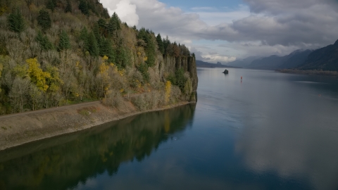 Railroad tracks below a cliff in the Columbia River Gorge, Oregon Aerial Stock Photos | AX154_004.0000307F