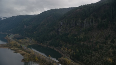 A waterfall on a Columbia River Gorge cliff in Multnomah County, Oregon Aerial Stock Photos | AX154_017.0000351F