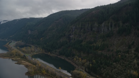 A waterfall on a Columbia River Gorge cliff face in Multnomah County, Oregon Aerial Stock Photos | AX154_018.0000000F