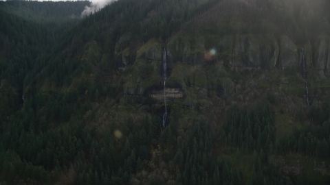 Cliffside waterfall in Columbia River Gorge in Multnomah County, Oregon Aerial Stock Photos | AX154_018.0000408F