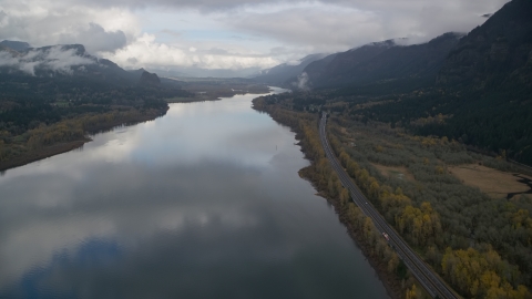 AX154_022.0000310F - Aerial stock photo of Highway beside the Columbia River Gorge on the Multnomah County, Oregon side of the river