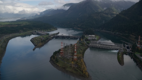 AX154_029.0000253F - Aerial stock photo of The Bonneville Dam structure in Columbia River Gorge