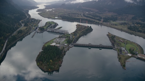 AX154_034.0000246F - Aerial stock photo of The Bonneville Dam and the Columbia River in the Columbia River Gorge