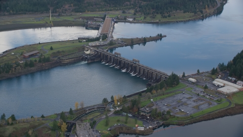 AX154_037.0000325F - Aerial stock photo of Bonneville Dam in Columbia River Gorge