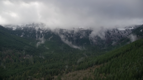 Snowy mountains at the end of a canyon with evergreen trees in Cascade Range, Hood River County, Oregon Aerial Stock Photos | AX154_057.0000000F