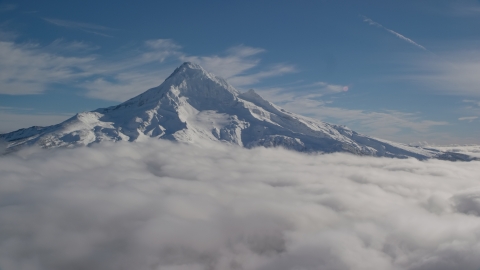 AX154_072.0000320F - Aerial stock photo of The Mount Hood summit with snow and low clouds, Mount Hood, Cascade Range, Oregon