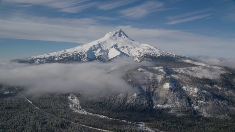 AX154_108.0000000F - Aerial stock photo of Low clouds over snowy forest near Mount Hood, Cascade Range, Oregon