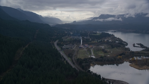 AX154_165.0000339F - Aerial stock photo of I-84 and the small town of Cascade Locks, Oregon in Columbia River Gorge