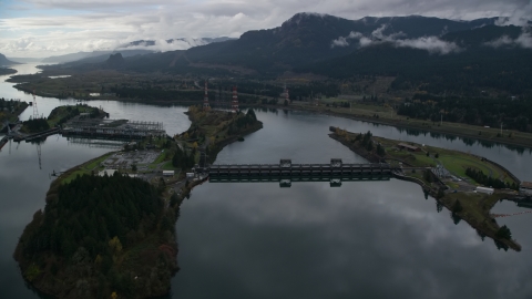 AX154_177.0000071F - Aerial stock photo of The Bonneville Dam structures on the Columbia River in the Columbia River Gorge