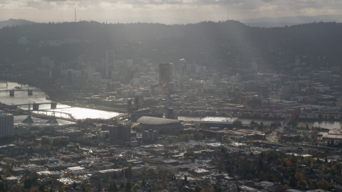 Godrays shining on Moda Center, the Willamette River and Downtown Portland, Oregon Aerial Stock Photos | AX154_224.0000249F