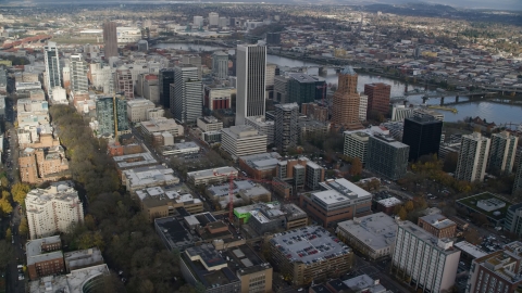 AX154_232.0000244F - Aerial stock photo of PacWest Center, Wells Fargo Center, KOIN Center and skyscrapers in Downtown Portland, Oregon