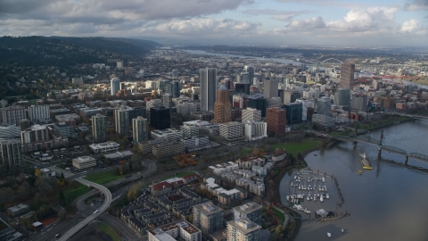 AX154_234.0000220F - Aerial stock photo of Skyscrapers in Downtown Portland, Oregon, and Riverplace Marina by Hawthorne Bridge