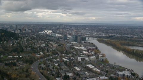 AX155_019.0000282F - Aerial stock photo of Condo high-rises by the Willamette River in South Waterfront, Downtown Portland, Oregon