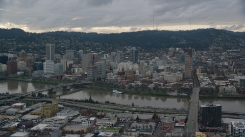 AX155_043.0000000F - Aerial stock photo of Bridges over the Willamette River and Downtown Portland, Oregon