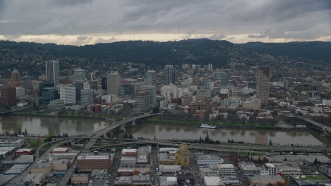 AX155_043.0000227F - Aerial stock photo of Bridges over the Willamette River and Downtown Portland, Oregon