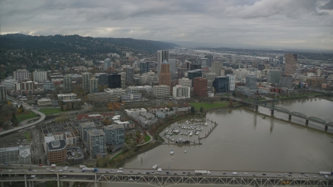 AX155_063.0000342F - Aerial stock photo of Bridges spanning Willamette River near Downtown Portland, Oregon