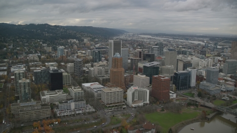 AX155_064.0000207F - Aerial stock photo of KOIN Center, Wells Fargo Center near PacWest Center in Downtown Portland, Oregon