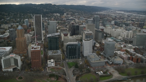 AX155_070.0000290F - Aerial stock photo of Riverfront park and skyscrapers in Downtown Portland, Oregon