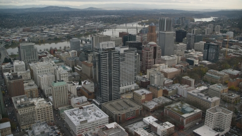 AX155_111.0000222F - Aerial stock photo of Skyscrapers and high-rises around Park Avenue West Tower near the Willamette River in Downtown Portland, Oregon