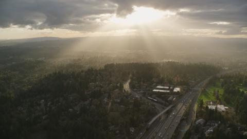 AX155_118.0000246F - Aerial stock photo of Godrays shining on neighborhoods and Highway 26, Southwest Portland, Oregon