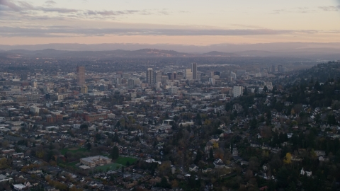 AX155_141.0000349F - Aerial stock photo of Downtown Portland at sunset, seen from hillside houses in Northwest Portland, Oregon