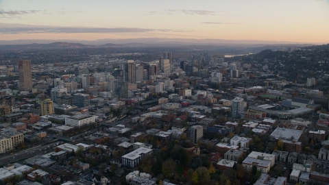 AX155_144.0000296F - Aerial stock photo of Providence Park near I-405 and Downtown Portland, Oregon, sunset