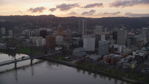 AX155_174.0000098F - Aerial stock photo of The Hawthorne Bridge, the waterfront park and Downtown Portland at sunset in Oregon