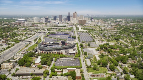 AX36_032.0000294F - Aerial stock photo of Turner Field and Downtown Atlanta skyline in the distance, Georgia