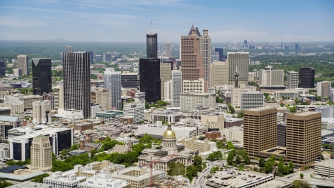 AX36_035.0000288F - Aerial stock photo of The Georgia State Capitol near Downtown Atlanta skyscrapers in Georgia