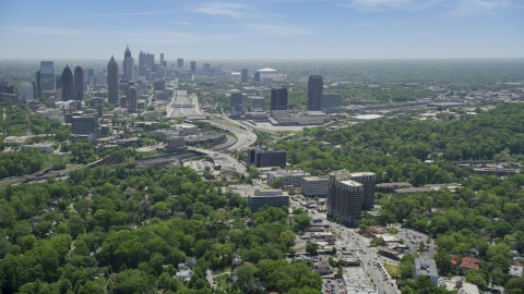 AX36_084.0000062F - Aerial stock photo of Peachtree Road toward Midtown skyline; Atlanta, Georgia