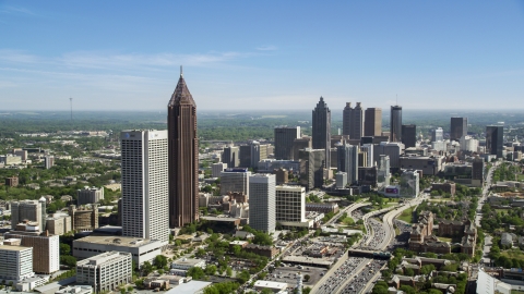 AX37_042.0000083F - Aerial stock photo of Midtown skyscrapers with Downtown in the distance, Atlanta, Georgia