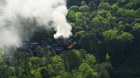 Smoke and flames rising from a burning home, West Atlanta, Georgia Aerial Stock Photos | AX38_052.0000000F