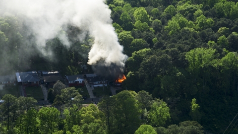 Smoke and flames rising from a burning home, West Atlanta, Georgia Aerial Stock Photos | AX38_052.0000129F