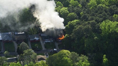 Smoke and flames from a burning home, West Atlanta, Georgia Aerial Stock Photos | AX38_052.0000276F