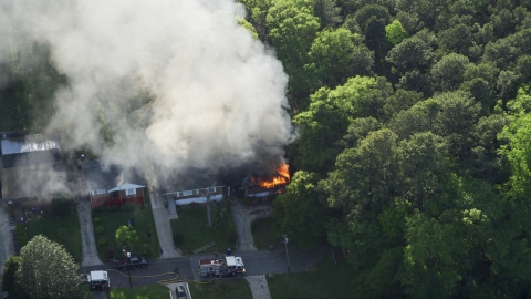 Looking down on a burning home with smoke rising, West Atlanta, Georgia Aerial Stock Photos | AX38_053.0000016F