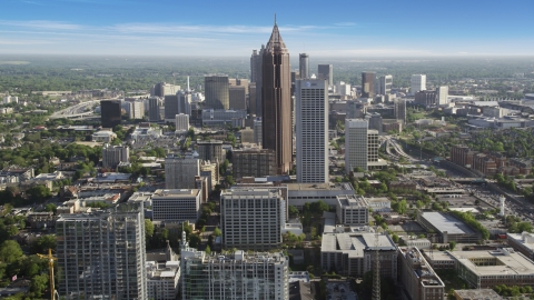 AX38_069.0000152F - Aerial stock photo of Bank of America Plaza, AT&T Midtown Center towering over citiy buildings, Midtown Atlanta