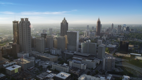 AX39_017.0000115F - Aerial stock photo of Skyscrapers and office buildings, hazy; Downtown Atlanta, Georgia